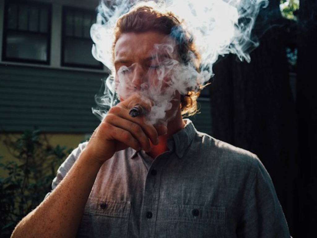  A man smoking a cigar